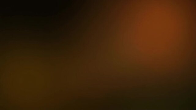Warm honey-gold gradient light shifts and blends gradually across deep black, creating soft ambient glow, calming cinematic atmosphere, smooth color transitions, and elegant abstract motion.
