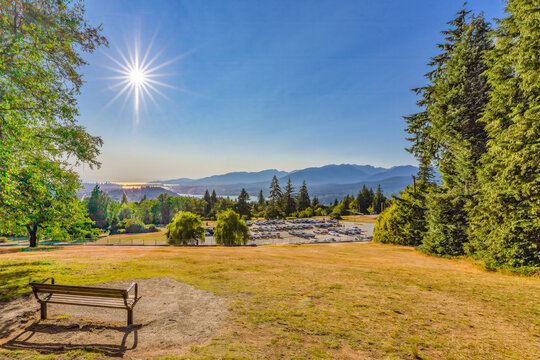 View from Burnaby Mountain Park through smoke haze from distant BC forest fires  all the way down Burrard Inlet to Stanley Park and downtown Vancouver.