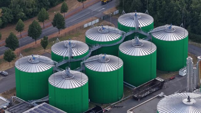Biogas plant aerial view with green fermentation silos