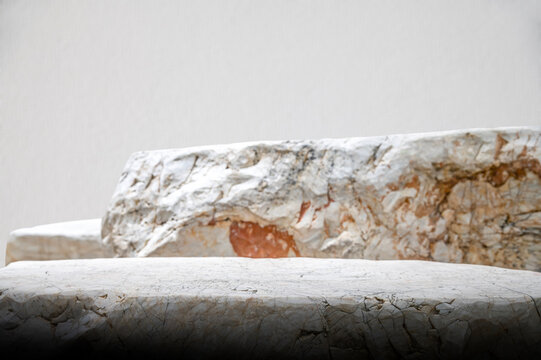 Textured Marble Pedestal with White Studio Wall Background.