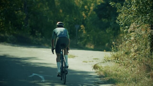 Cyclist Riding Road Bicycle On Asphalt Countryside Path During Cycling Workout