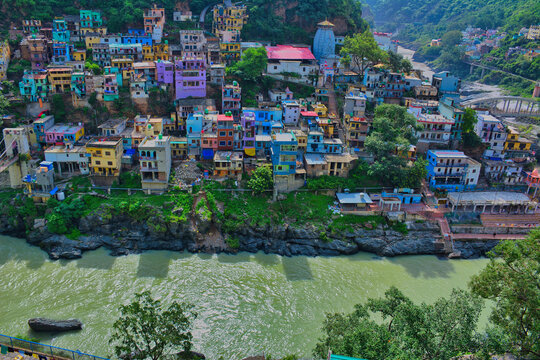 Scenic View of Devprayag River Confluence Surrounded by Himalayan Villages and Green Mountains