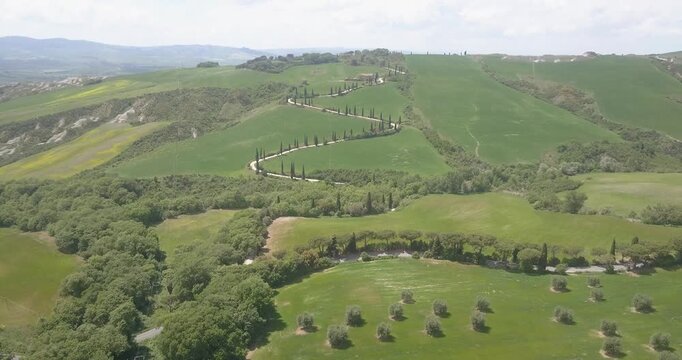 Val d'Orcia, Tuscany, Italy, aerial drone view, winding road with cypresses