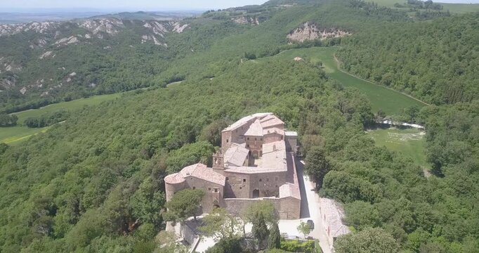Val d'Orcia, Tuscany, Italy, aerial drone view, winding road with cypresses