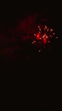 Spectacular golden fireworks exploding in night sky