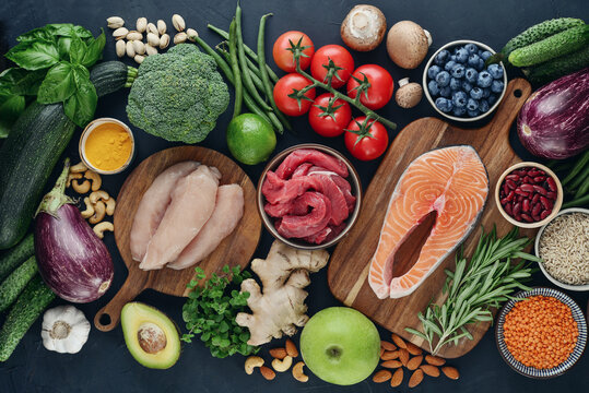 Top view of raw whole foods for Mediterranean diet, clean eating and nutritious meal planning.