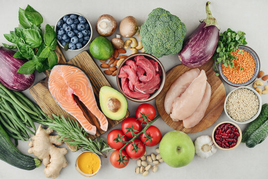 Top view of raw whole foods for Mediterranean diet, clean eating and nutritious meal planning.