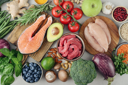 Top view of raw whole foods for Mediterranean diet, clean eating and nutritious meal planning.