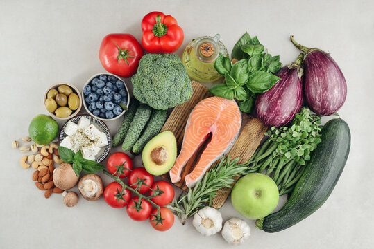 Top view of raw whole foods for Mediterranean diet, clean eating and nutritious meal planning.