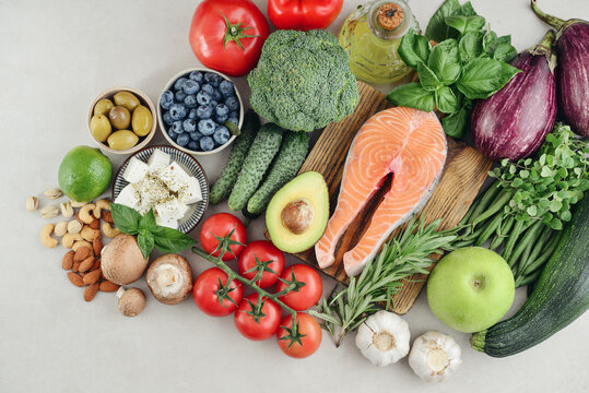 Top view of raw whole foods for Mediterranean diet, clean eating and nutritious meal planning.