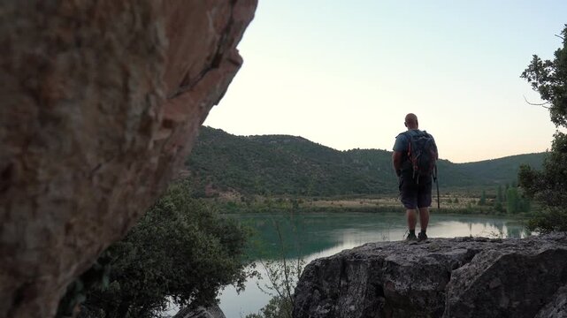 Hiker in the rock looking the landscape