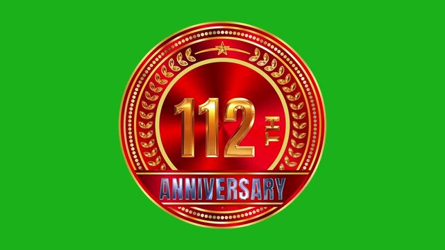 Decorative 112th anniversary golden badge with crimson metallic radial background and studio lighting 4k video