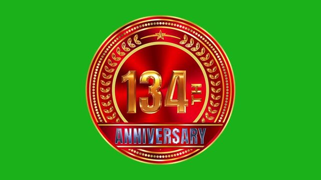 Luminous 134th anniversary golden mark set on ruby red metallic radial plate with studio spotlighting 4k video