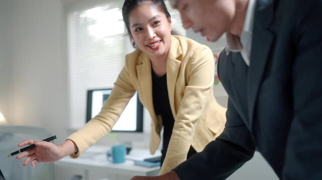 Business Team Discussing Data in Modern Office