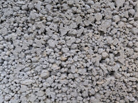 Extreme close-up macro texture of rough porous lightweight concrete block surface