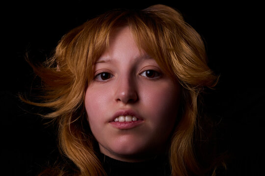 Young woman face portrait with serious expression