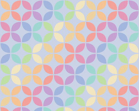 A soft pastel quatrefoil design repeats in blue, pink, lavender, and coral tones, creating a cheerful modern surface for wallpaper, stationery, textiles, and seasonal decor.