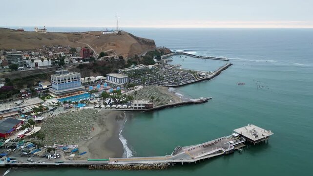Aerial drone view of the Lima coastline in Chorrillos featuring the exclusive Club Regatas.