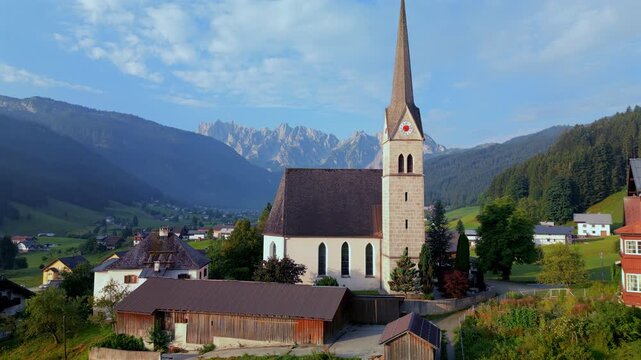 Aerial view of the historic church in the picturesque Gosau village, Austria, Austrian Alps.