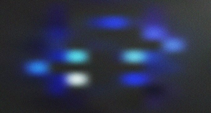 Symmetrical blue and cyan glowing points creating a structured abstract bokeh pattern with digital texture