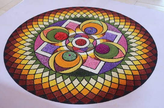 pookalam designs for onam celebrations , pookalam made for part of onam celibration in kerala, india. it also referred to as athapookalam, is often made in a circular shape with flowers on floor