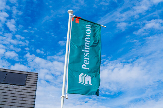Telford, Shropshire, UK - August 9th 2026: Flag of house builders, Persimmon, flying outside of a site in Telford