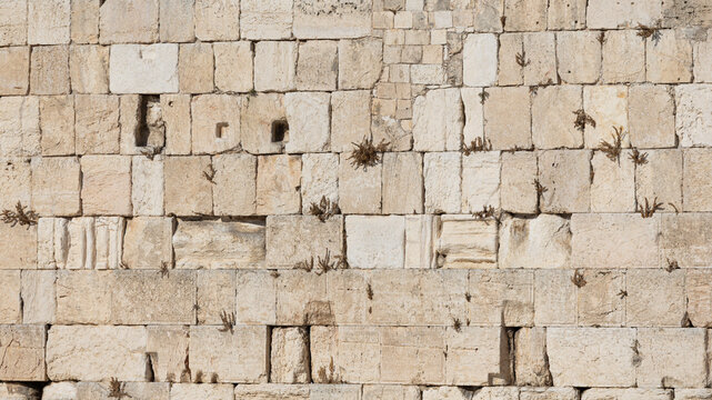 Texture of the ancient stone blocks of the Western Wall in Jerusalem