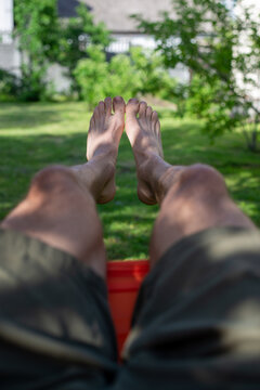 Relaxing Bare Feet in Summer Backyard