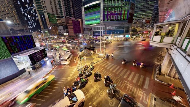 traffic in central bangkok with code and data overlayed in the buildings 
