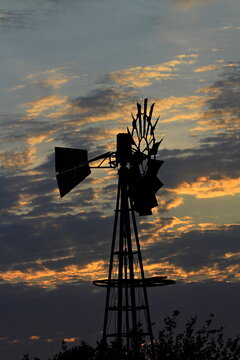  Kansas windmill at sunset with clouds