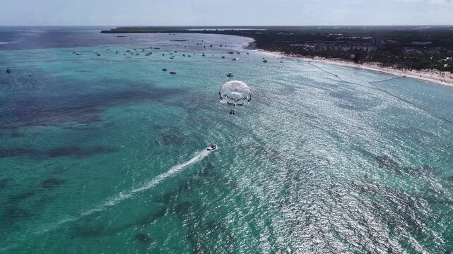 Parasailing At Bavaro In Punta Cana Dominican Republic. Caribbean Skyline. Beach Landscape. Nature Seascape. Parasailing In Bavaro In Punta Cana Dominican Republic. Scenic Water Sport.