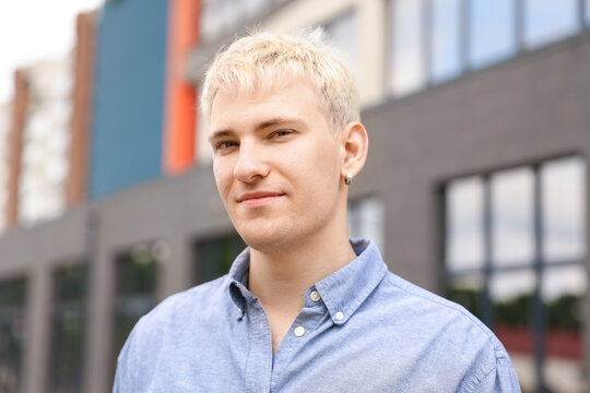 Portrait of handsome man in shirt outdoors