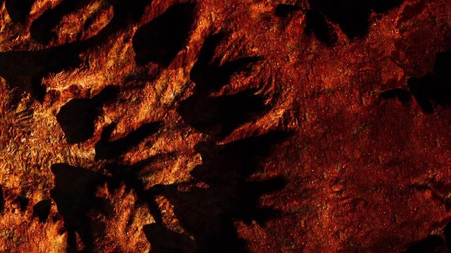 The surface shows rocks with a rough texture and warm colors. Shadows cast on the surface create patterns in the natural setting, which may be outdoors.