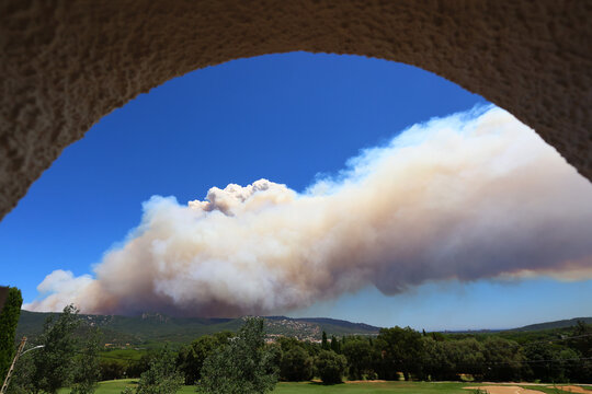 Wildfire Smoke Rising Behind the Hills