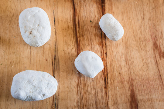 Andean white chu&ntilde;o in an ancestral ceramic pot and plate on a wooden table, raw organic chu&ntilde;os for a healthy vegetarian kitchen and natural nutrition.
