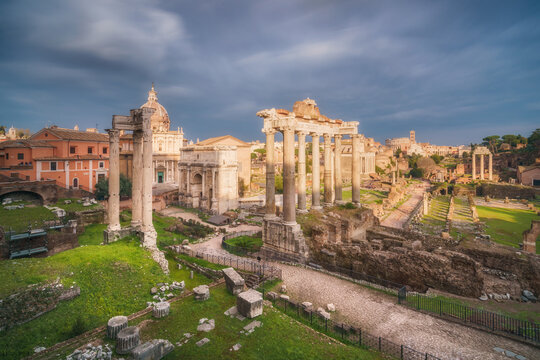 Moody sky over The Roman forum with the Temple of Saturn in the foreground, Rome, Lazio, Italy