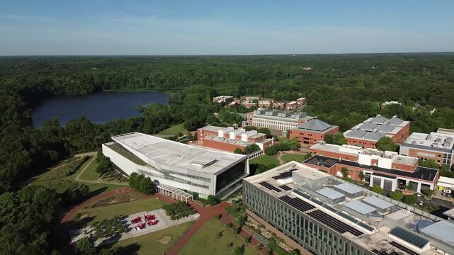 Aerial panning view of Centennial Campus at NC State University in Raleigh , North Carolina with Lake Raleigh in the distance