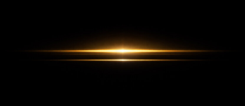 Golden horizontal lens flare and luminous light streaks on black background