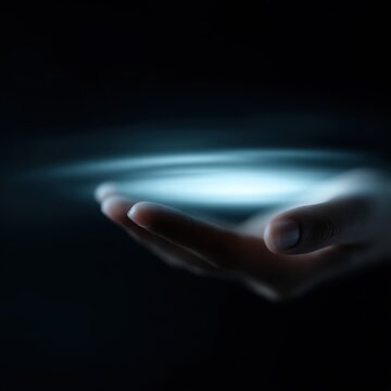 hand holding glowing hologram interface isolated on dark background futuristic ui concept