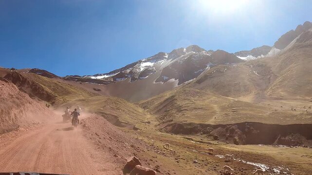 ATV quad bikes riding through the spectacular Andes mountains near Cusco, Peru
