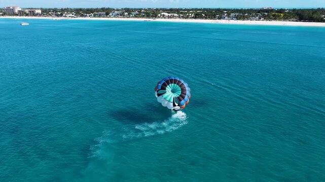 Parasail At Providenciales In Turks And Caicos Islands. Turquoise Beach. Nature Landscape. Wind Sport. Parasail In Turks And Caicos Islands. Wind Sport Landscape.