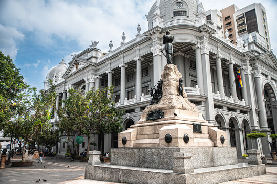 Historic Municipal Palace of Guayaquil overlooking Plaza de la Administraci&oacute;n in Ecuador, featuring an ornate neoclassical facade, monumental columns, domes and a prominent historic monument
