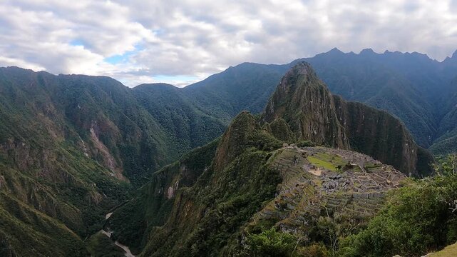 Tourists hiking near the ancient Inca citadel in the Andes