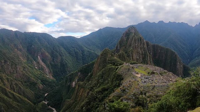 Tourists hiking near the ancient Inca citadel in the Andes