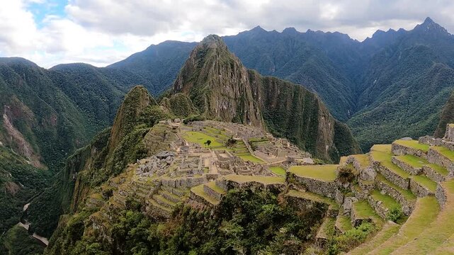 Tourists hiking near the ancient Inca citadel in the Andes