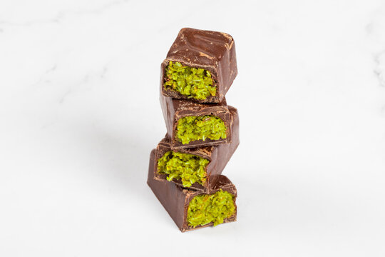 Pistachio bar. In chocolate glaze. Dubai chocolate candy bar with crispy kataifi and pistachio paste. Close up