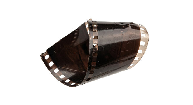 Curled strip of old photographic film with perforations and scratches