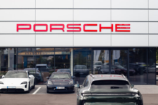 Riga, Latvia - August 8, 2026: The photo shows a Porsche dealership and parked Porsche cars