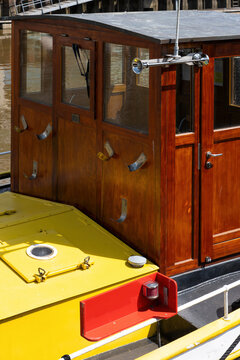 Traditional Wooden Boat Wheelhouse with Brass Ship Horn