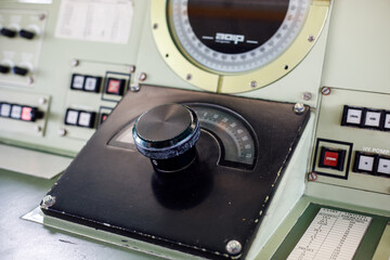  Ship control dial with a large gauge on a bridge panel, showing navigation equipment used to operate a working vessel © Татьяна Швец